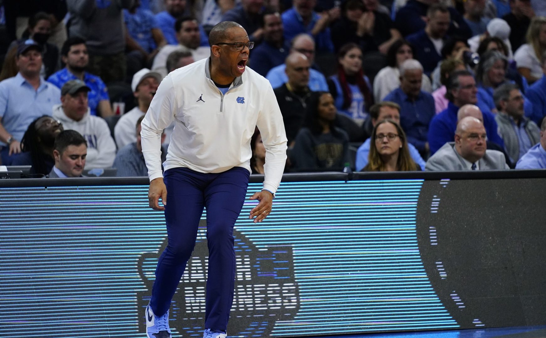 North Carolina head coach Hubert Davis reacts during the first half of a college basketball game against UCLA in the Sweet 16 round of the NCAA tournament, Friday, March 25, 2022, in Philadelphia. (AP Photo/Matt Rourke)