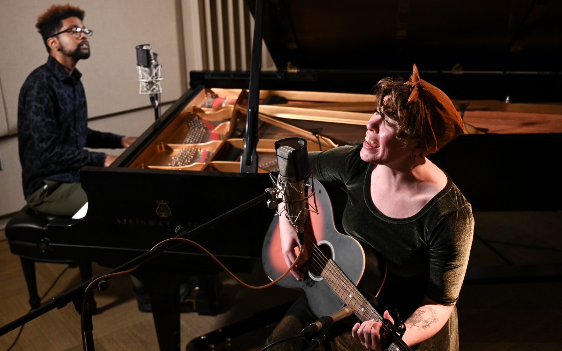 Elijah Cross and Macy Leonard performing in the studio.