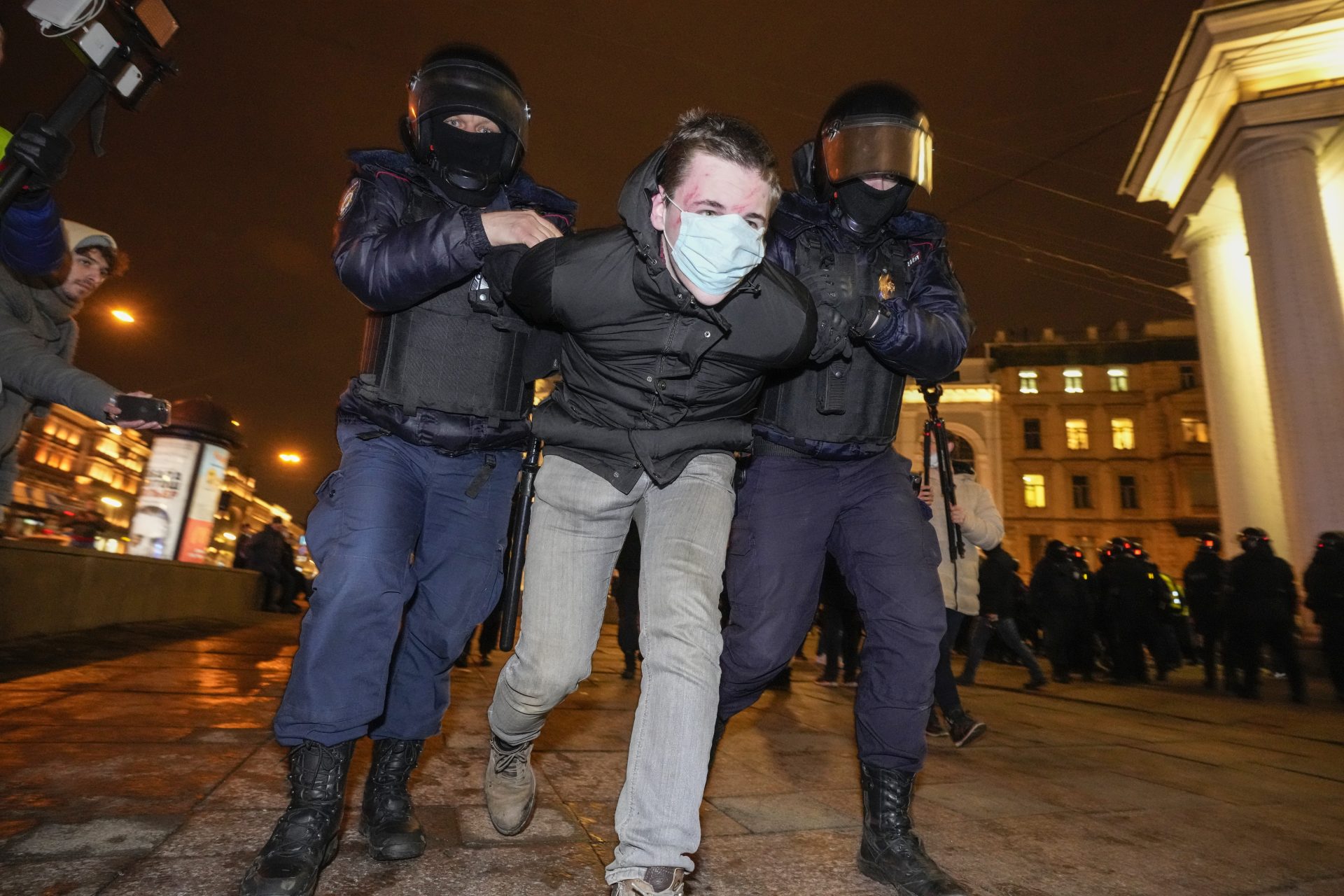 Police detain a demonstrator during an action against Russia's attack on Ukraine in St. Petersburg, Russia, Wednesday, March 2, 2022. Protests against the Russian invasion of Ukraine resumed on Wednesday, with people taking to the streets of Moscow and St. Petersburg and other Russian towns despite mass arrests.