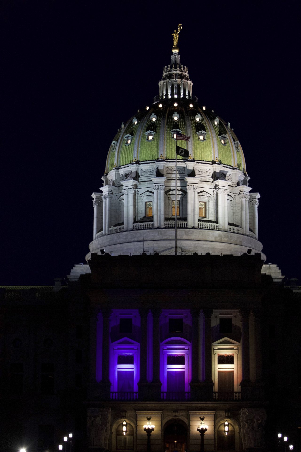 The Pennsylvania Capitol is lit at night in the yellow and blue colors of the Ukrainian flag in solidarity with Ukraine amid the Russian invasion, Saturday, Feb. 26, 2022, in Harrisburg, Pa.