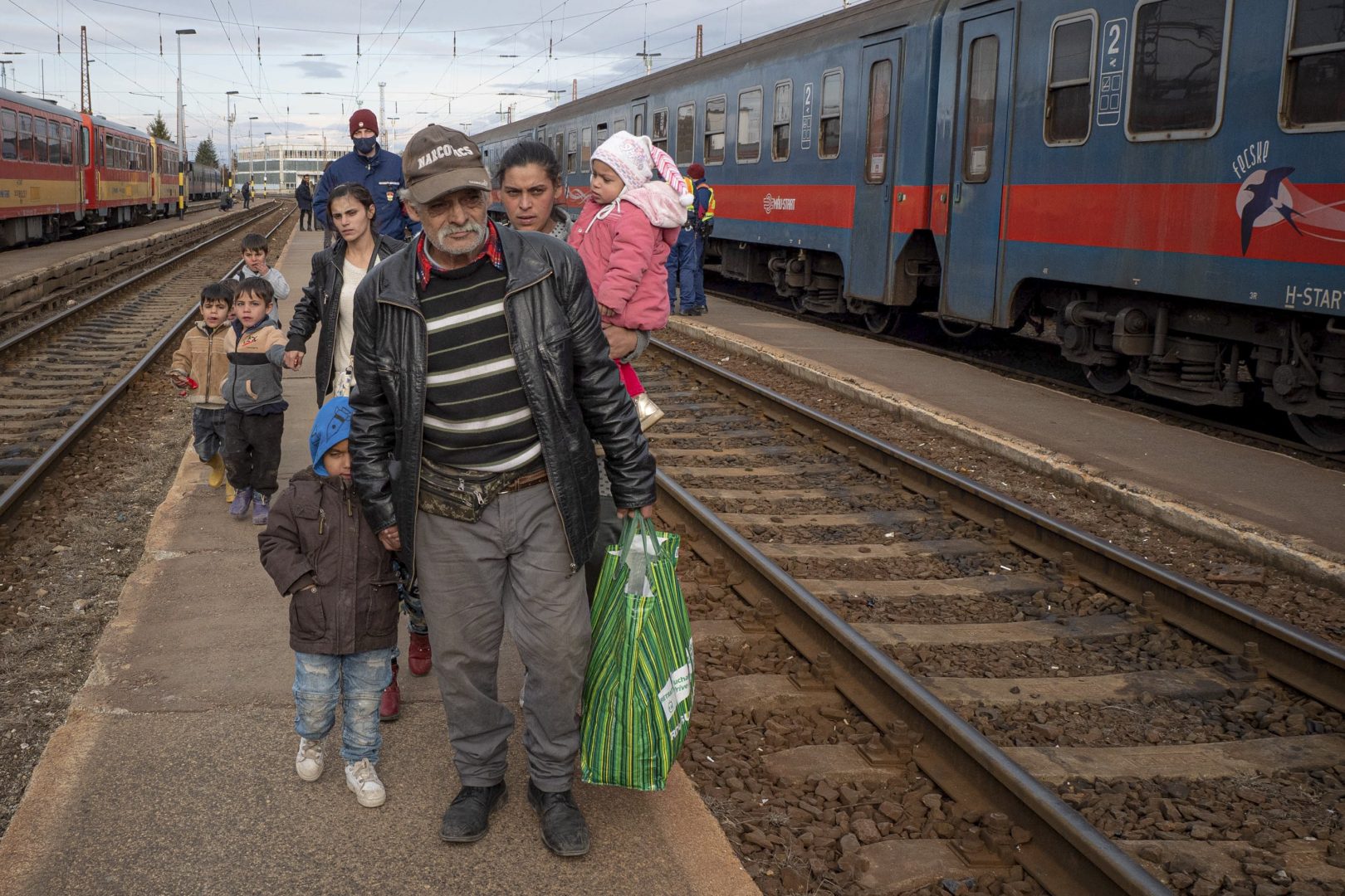 Refugees fleeing the war from neighboring Ukraine walk on a platform after disembarking from a train in Zahony, Hungary, Wednesday, March 2, 2022. 