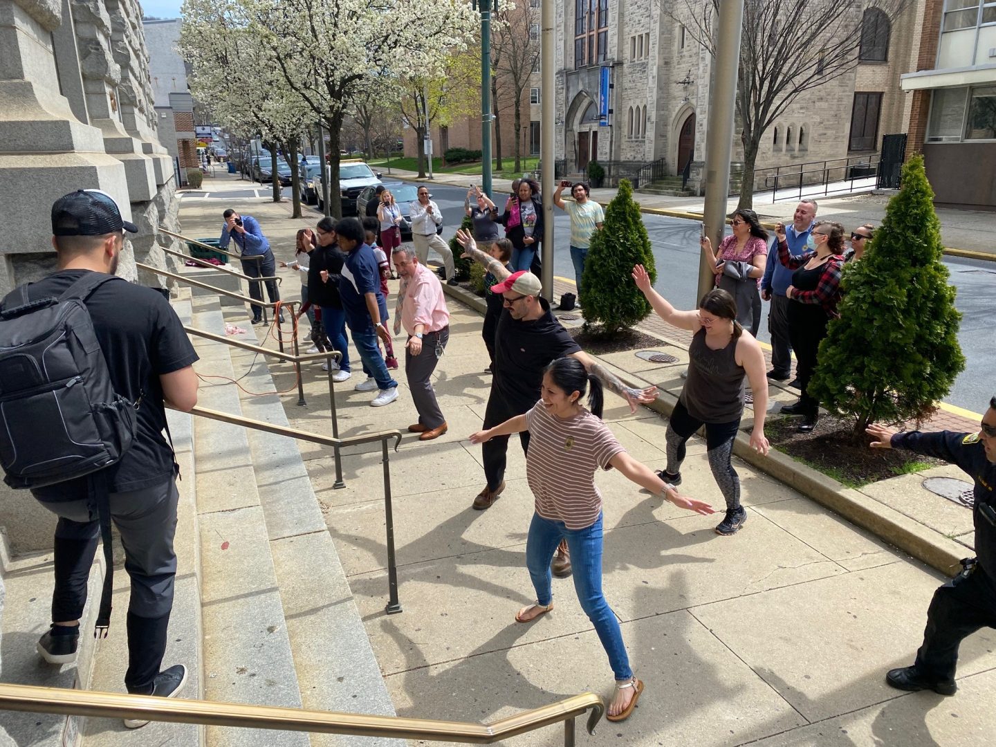 Berks4Peace, an initiative of RIZE, holds a pop-up dance and music event in front of Reading City Hall Wednesday. Reading Mayor Eddie Moran, Reading Police, City Hall employees and pedestrians joined in on the dance. 