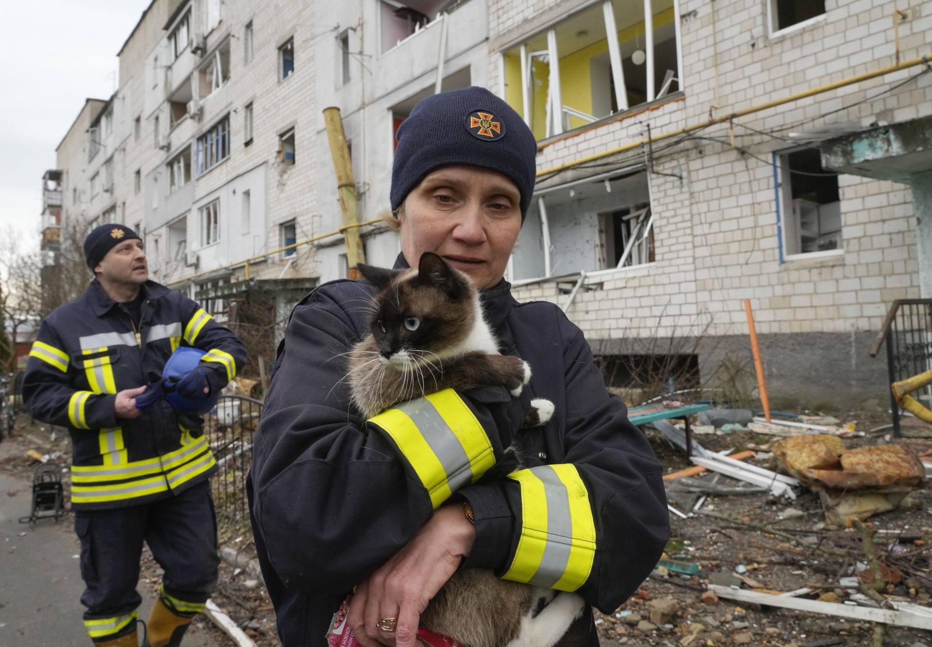 An emergency worker holds a rescued cat in Borodyanka, Ukraine, Wednesday, Apr. 6, 2022.