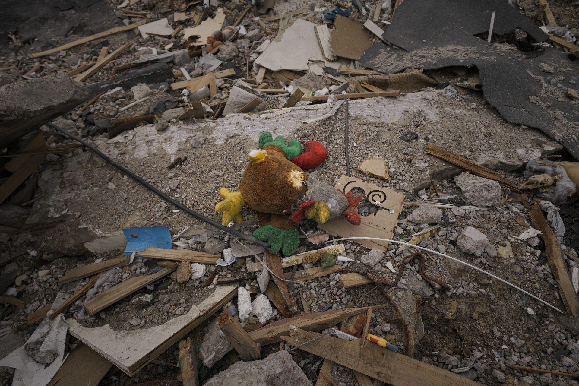 A toy lies in the rubble of an apartment building destroyed during fighting between Ukrainian and Russian forces in Borodyanka, Ukraine, Tuesday, April 5, 2022.