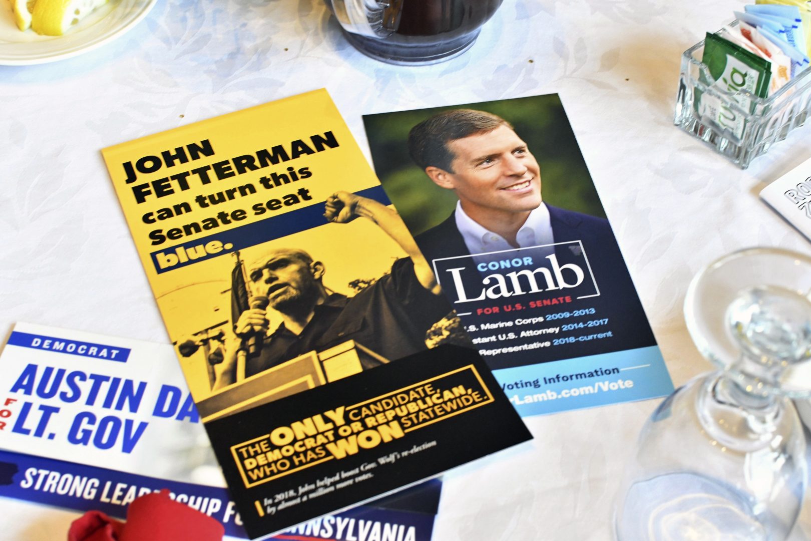 Literature for Conor Lamb and John Fetterman lie on a table where both Democratic candidates for U.S. Senate were speaking at a Centre County Democrats' breakfast event at a hotel at the Mountain View Country Club, Saturday, April 9, 2022, in Boalsburg, Pa. 