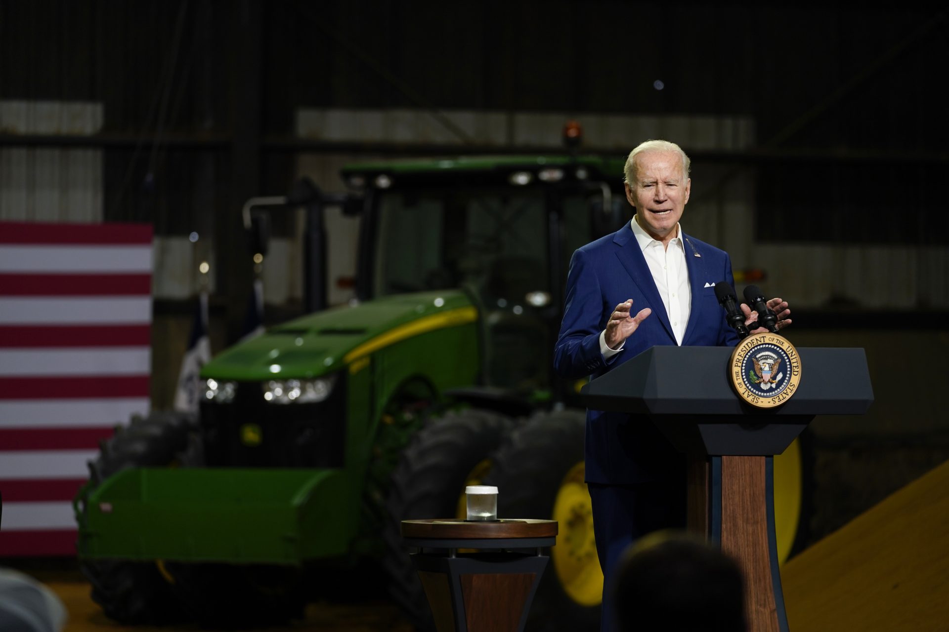 President Joe Biden speaks, with a pile of corn meal as a backdrop, at POET Bioprocessing in Menlo, Iowa, Tuesday, April 12, 2022.