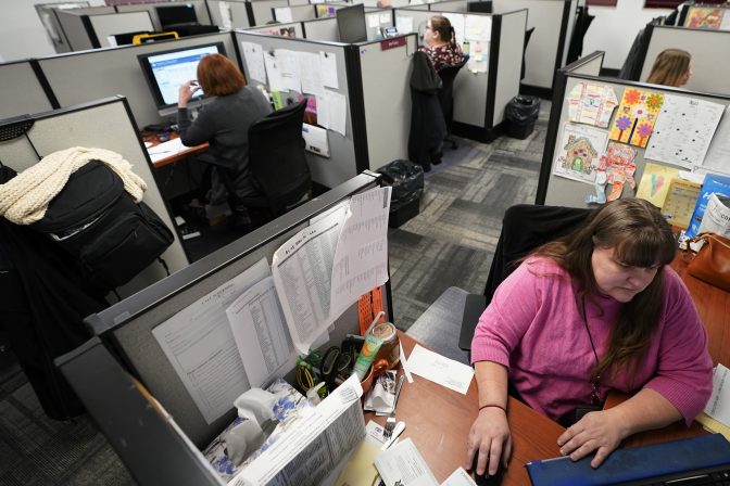 Workers field calls at an intake call screening center for the Allegheny County Children and Youth Services office in Penn Hills, Pa. on Thursday, Feb. 17, 2022.