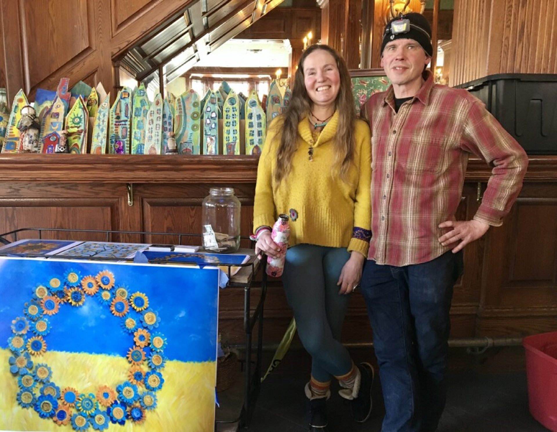 Olga and John Snyder, of Coudersport, have been working to support Ukrainians, where Olga is originally from, even as they dealt with a fire in their downtown business. They have been collecting donations for prints of the painting Olga made representing Ukraine's flag and national flower, the sunflower.