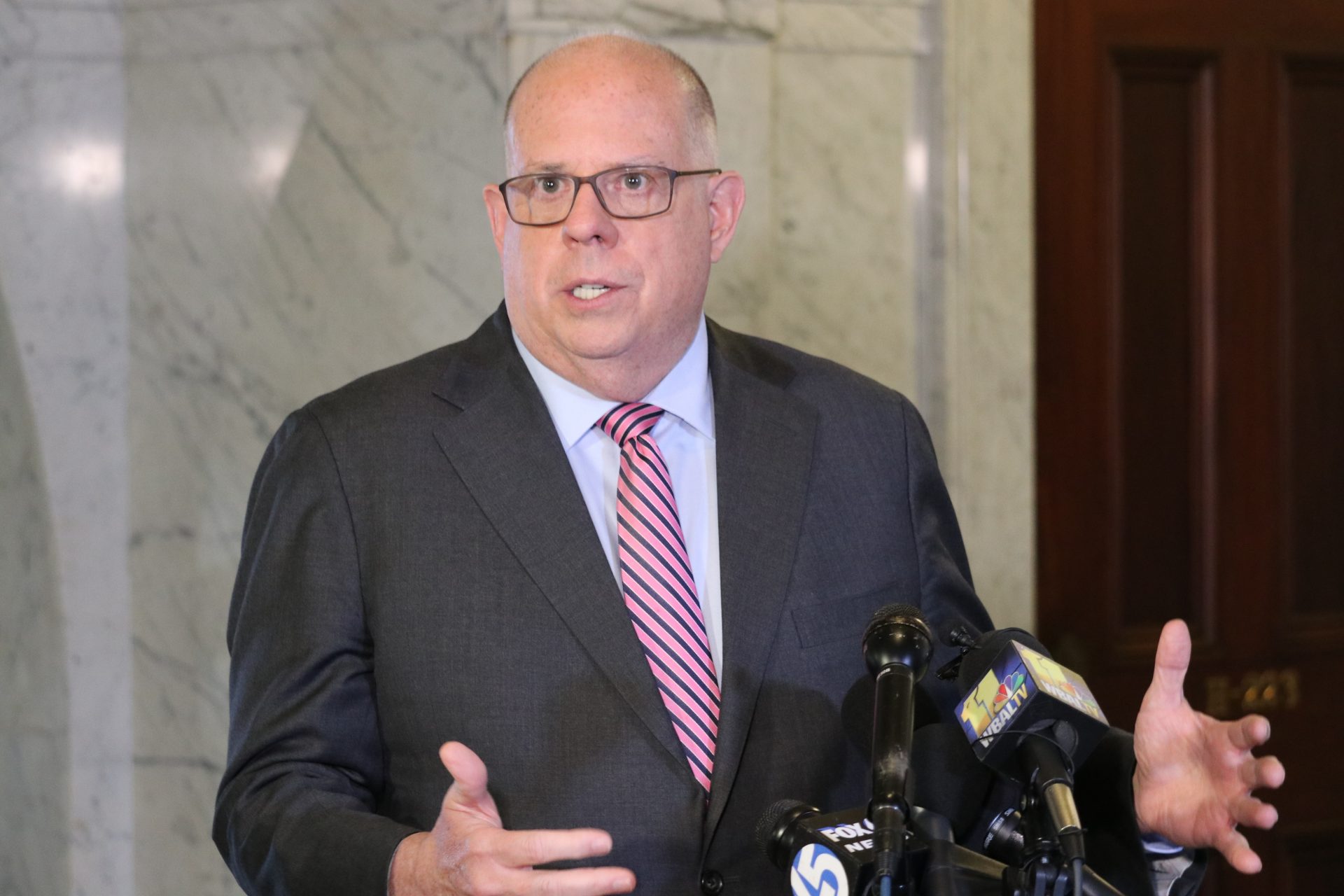 Maryland Gov. Larry Hogan talks to reporters after signing a measure to enact a new congressional map on Monday, April, 4, 2022 for the state’s eight U.S. House seats.