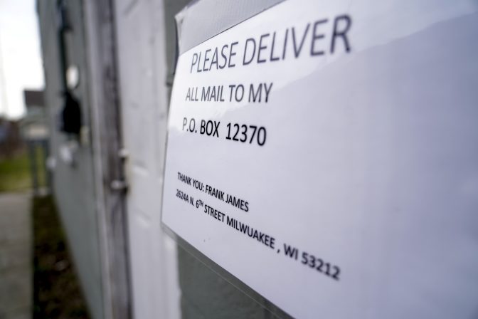 A sign is posted on the mailbox of Frank R. James at his apartment Wednesday, April 13, 2022, in Milwaukee.