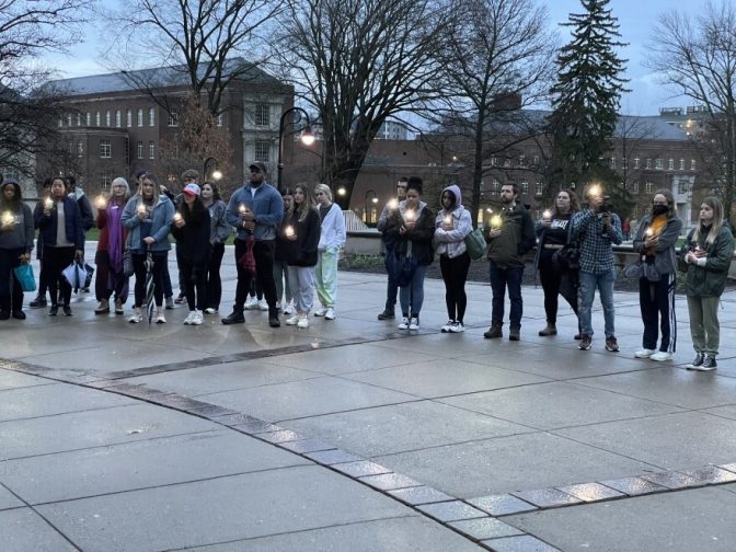 Students gathered at the bottom of the Old Main steps toward the end of the rally to provide a makeshift candlelight vigil for those who didn't survive their sexual assault cases.