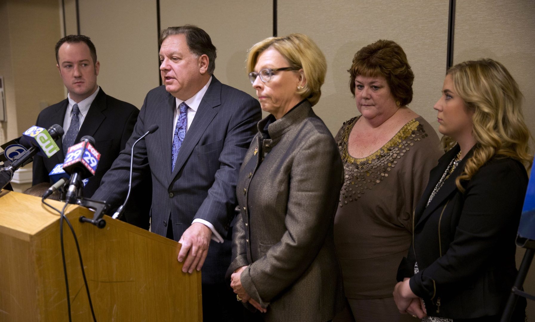 FILE -Attorneys Dan Monahan, at podium, and Marcia Hamilton, center right, take part during a news conference with the family of Sean McIlmail, brother Michael McIlmail, left, mother Debbie McIlmail, second right, and sister Kaitlyn McIlmail Wednesday, Nov. 13, 2013, in Philadelphia. 