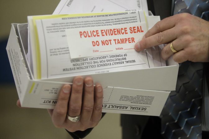 This Feb. 8, 2017, file photo, Utah State Crime Lab Director Jay Henry holds a sexual assault evidence collection kit following a committee meeting at the Utah State Capitol, in Salt Lake City.