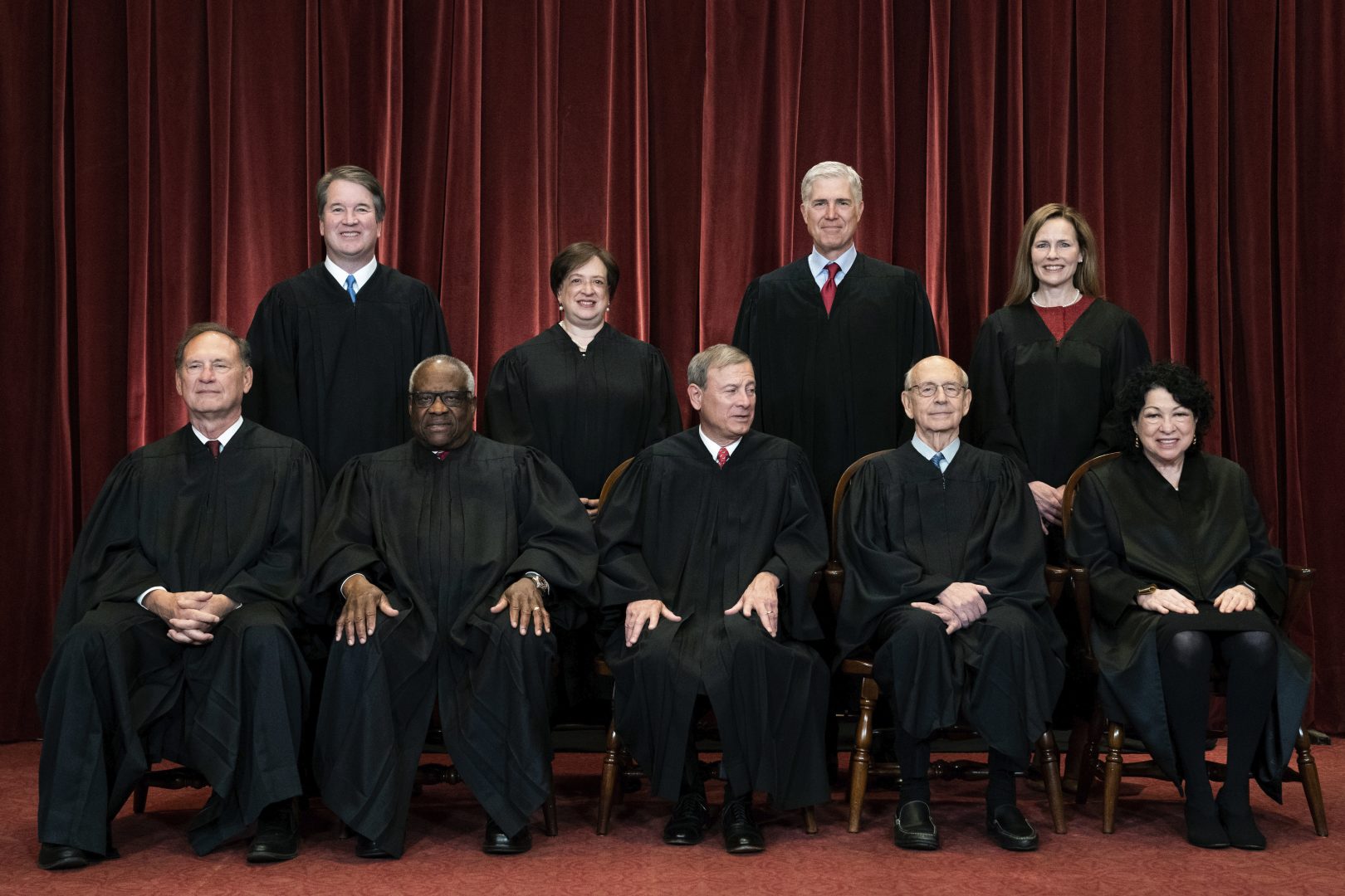 In this April 23, 2021, file photo, members of the Supreme Court pose for a group photo at the Supreme Court in Washington. Seated from left are Associate Justice Samuel Alito, Associate Justice Clarence Thomas, Chief Justice John Roberts, Associate Justice Stephen Breyer and Associate Justice Sonia Sotomayor, while standing from left are Associate Justice Brett Kavanaugh, Associate Justice Elena Kagan, Associate Justice Neil Gorsuch and Associate Justice Amy Coney Barrett. (Erin Schaff/The New York Times via AP, Pool)