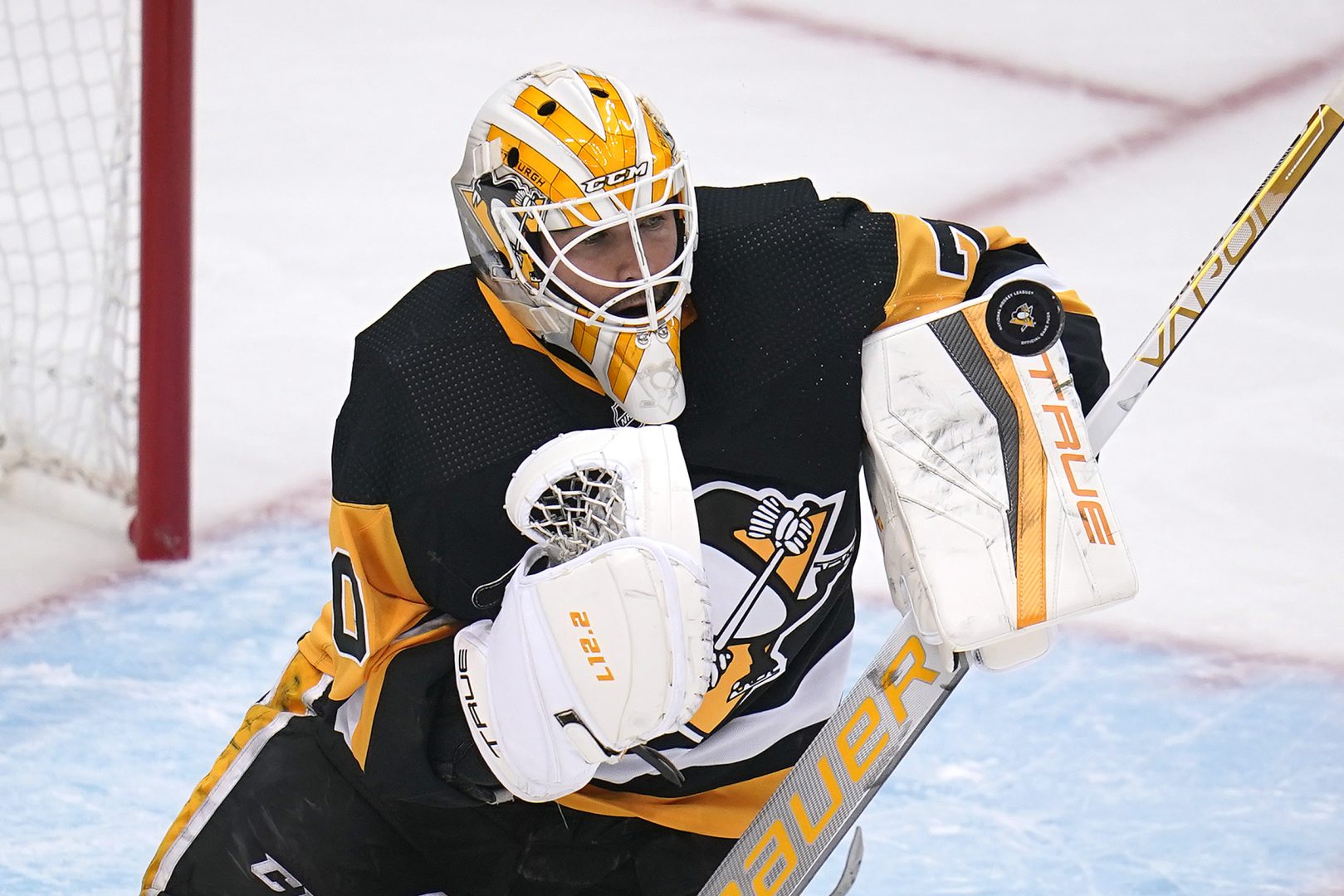 Pittsburgh Penguins goaltender Louis Domingue blocks a shot during the first period in Game 3 of an NHL hockey Stanley Cup first-round playoff series against the New York Rangers in Pittsburgh, Saturday, May 7, 2022. (AP Photo/Gene J. Puskar)
