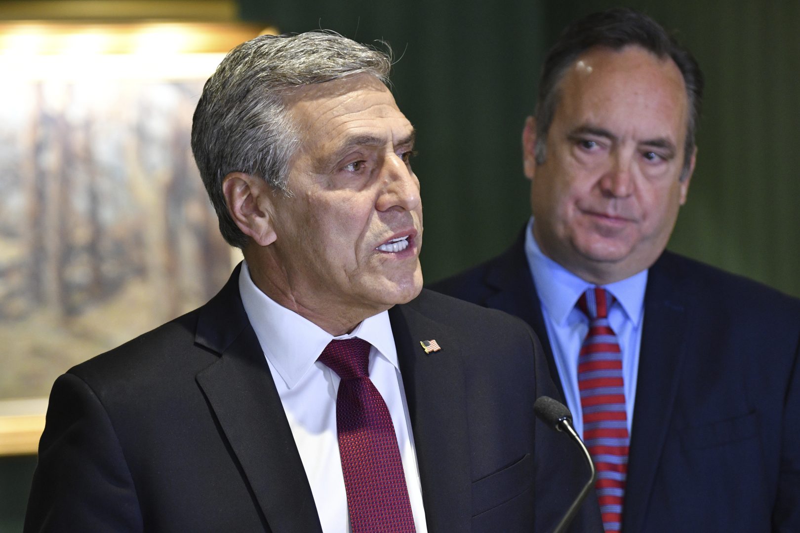 Lou Barletta speaks at a news conference where he accepted the endorsement of a rival in Pennsylvania's crowded Republican primary for governor, Jake Corman, right, May 12, 2022, in Harrisburg, Pa. Corman's endorsement comes as GOP leaders warn that leading Republican primary candidate Doug Mastriano is too far right to win in a general election.