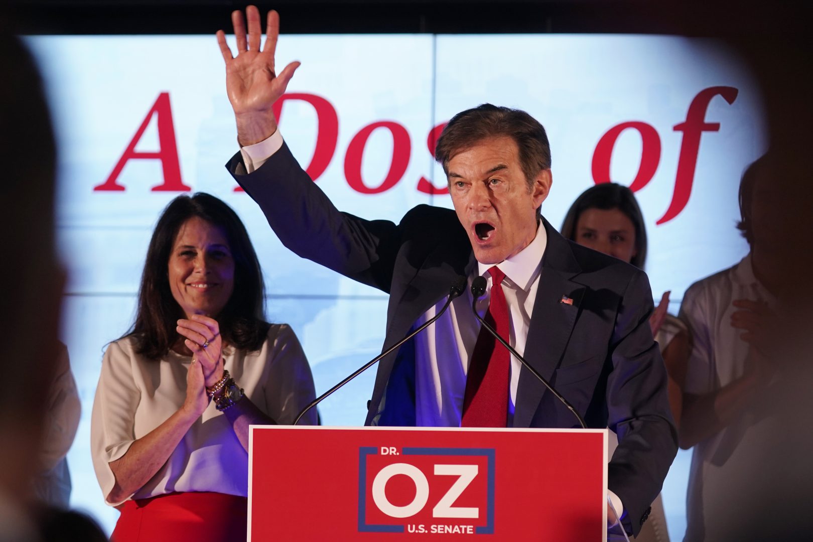 Mehmet Oz, a Republican candidate for U.S. Senate in Pennsylvania, right, waves in front of his wife, Lisa, while speaking at a primary night election gathering in Newtown, Pa., Tuesday, May 17, 2022.