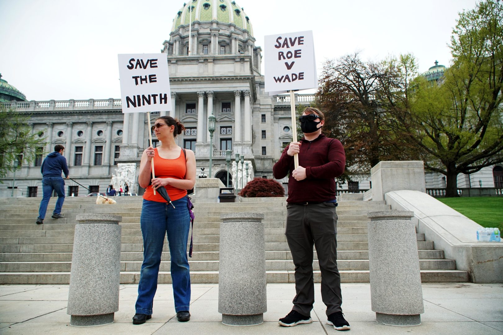 Katherine Deane of Lemoyne and Sam Lowe of Harrisburg protest on May 3, 2022 in front of the state Capitol after the news of a leaked draft opinion from the U.S. Supreme Court that would overturn Roe v. Wade was released. 
