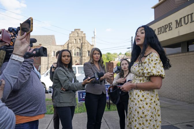 Gisele Barreto Fetterman, right, wife of Pennsylvania Lt. Governor John Fetterman, who is running for the Democratic nomination for the U.S. Senate for Pennsylvania, talks with reporters outside her polling place after voting in Braddock, Pa., Tuesday, May 17, 2022.