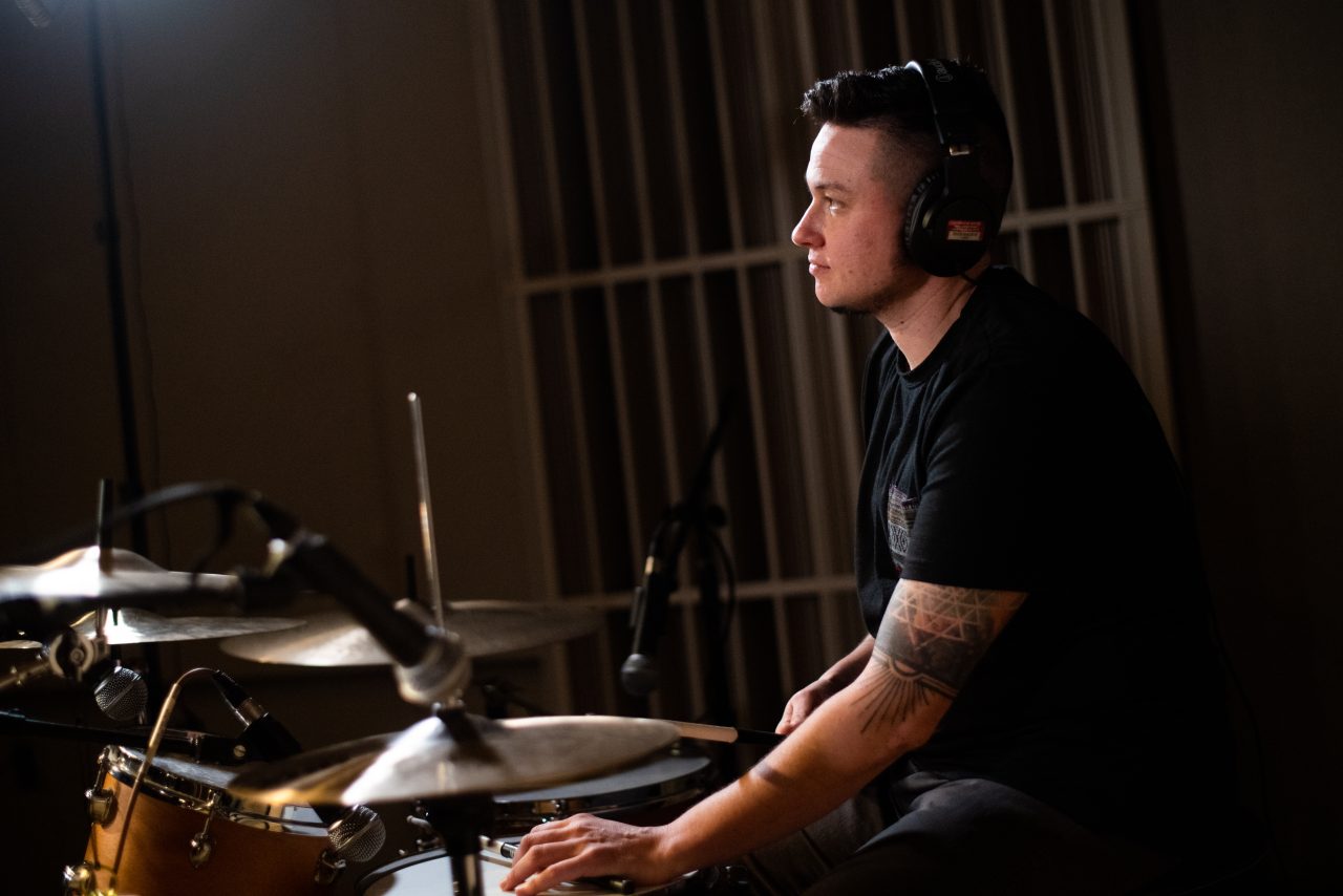 Drummer Dani Fiore performing in the studio.
