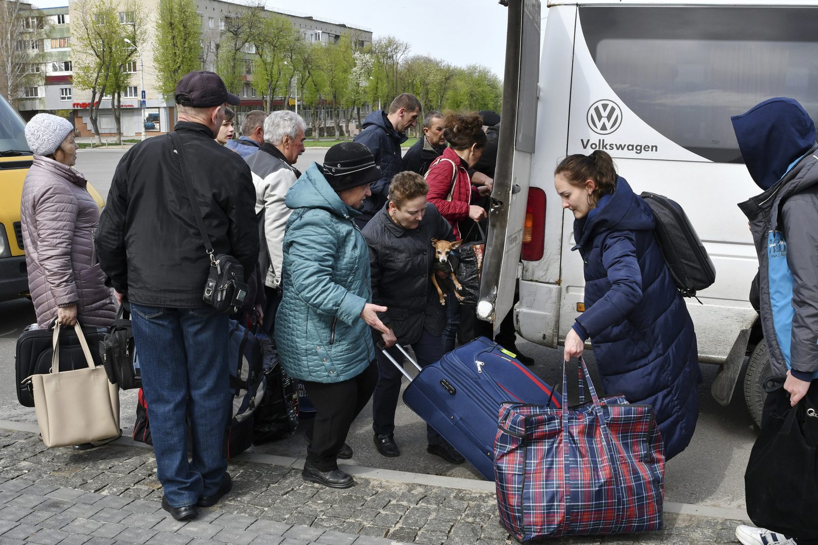 People board transport to move to Ukrainian city of Dnipro during an evacuation of civilians in Kramatorsk, Ukraine, Tuesday, April 19, 2022.