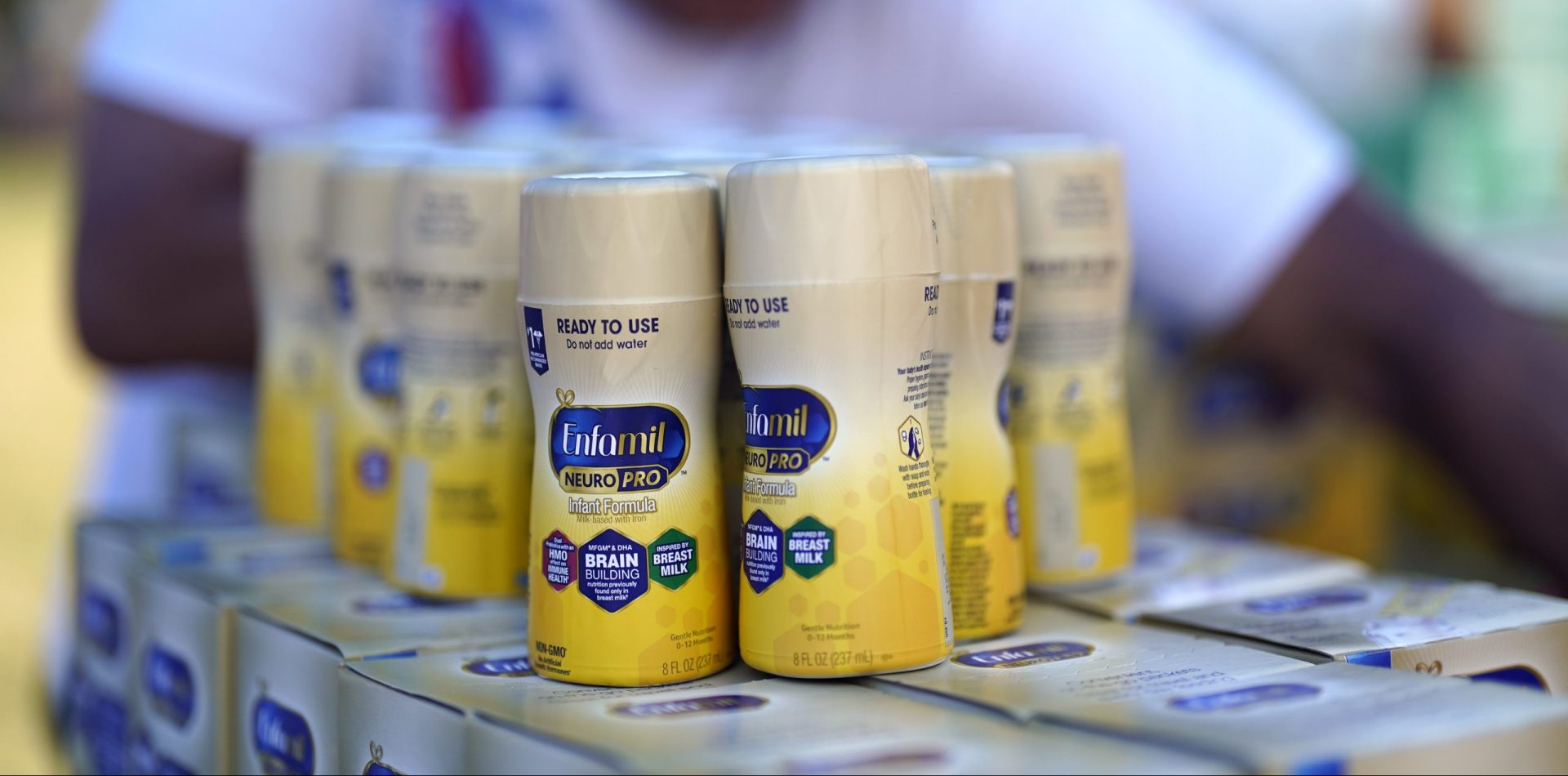Infant formula is stacked on a table during a baby formula drive to help with the shortage Saturday, May 14, 2022, in Houston.