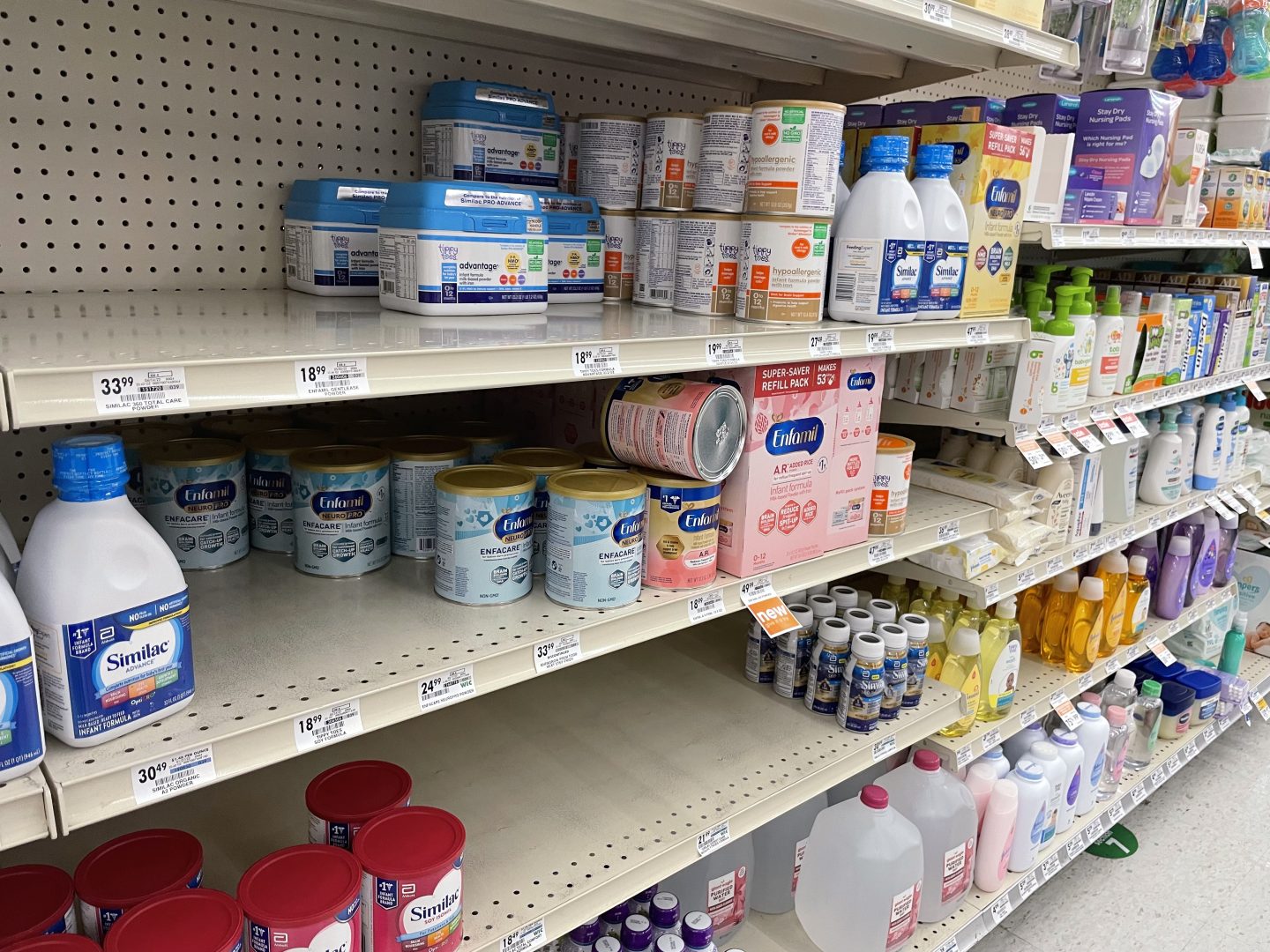 Shelves at a local pharmacy show signs of the ongoing baby formula shortage

