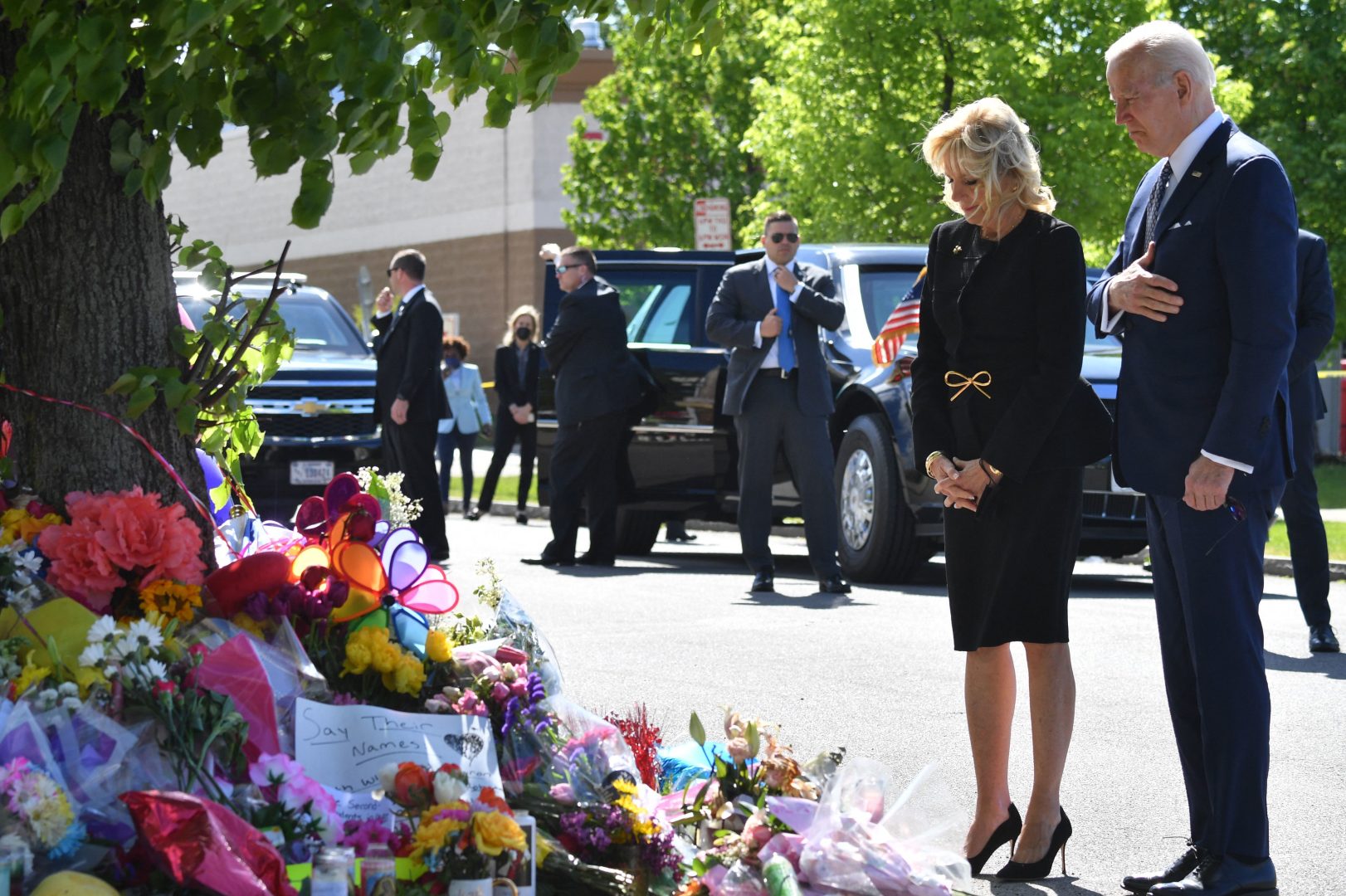 US President Joe Biden and US First Lady Jill Biden visit a memorial near a Tops grocery store in Buffalo, New York, on May 17, 2022. - Biden is visiting Buffalo after ten people were killed in a mass shooting at a grocery store on May 14, 2022. 