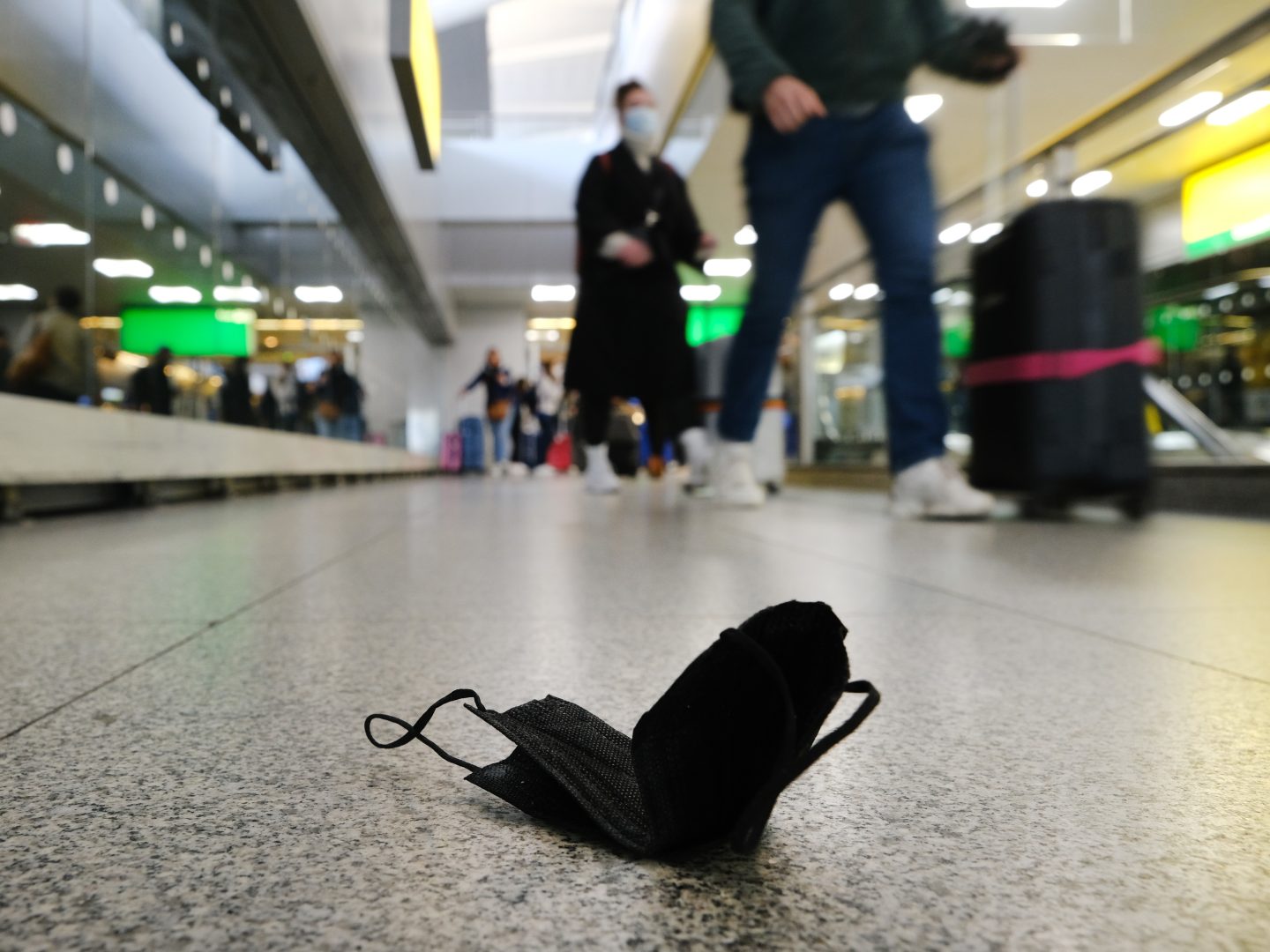 NEW YORK,  NY - APRIL 19: A mask is seen on the ground at John F.  Kennedy Airport on April 19, 2022 in New York City. On Monday, a federal judge in Florida struck down the mask mandate for airports and other methods of public transportation as a new COVID variant is on the rise across parts of the United States. (Photo by Spencer Platt/Getty Images)
