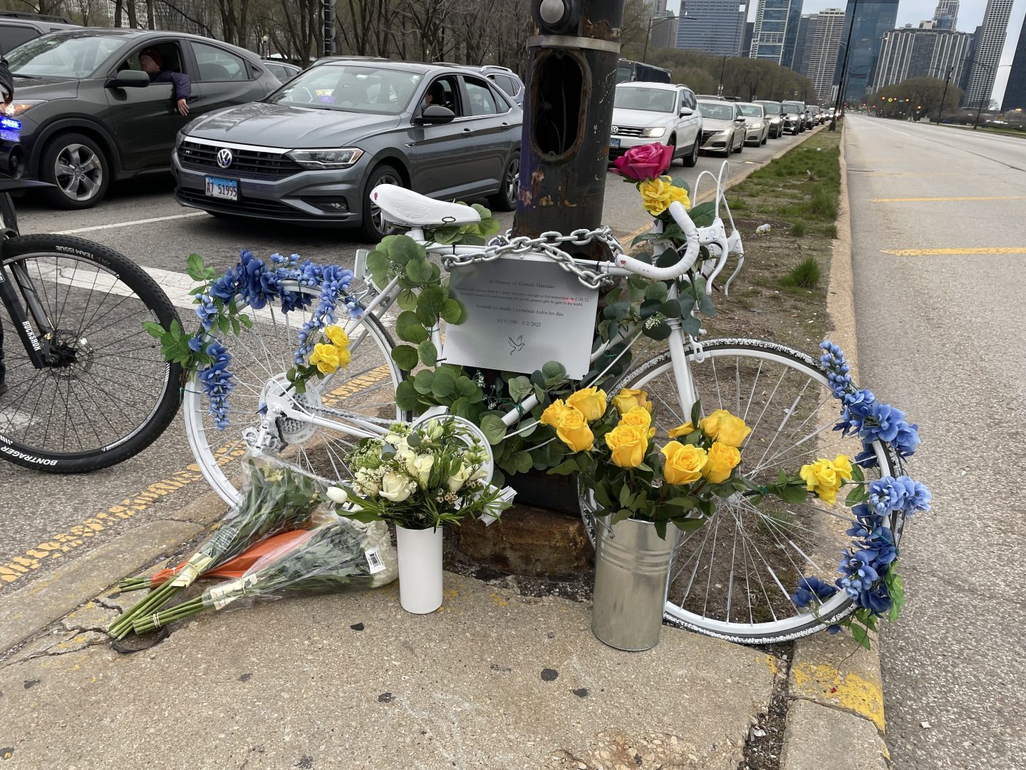 Jaime Bolognone prepare to take a ghost bike honoring her late fiancé, Gerardo Marciales, out into the intersection where he was recently killed.
