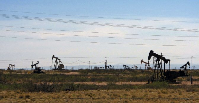 Oil rigs stand in the Loco Hills field along U.S. Highway 82 in Eddy County, near Artesia, N.M., one of the most active regions of the Permian Basin.