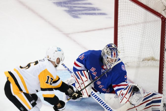 New York Rangers goaltender Igor Shesterkin (31) stops a shot on goal by Pittsburgh Penguins' Jason Zucker (16) during the second period of Game 5 of an NHL hockey Stanley Cup first-round playoff series Wednesday, May 11, 2022, in New York.
