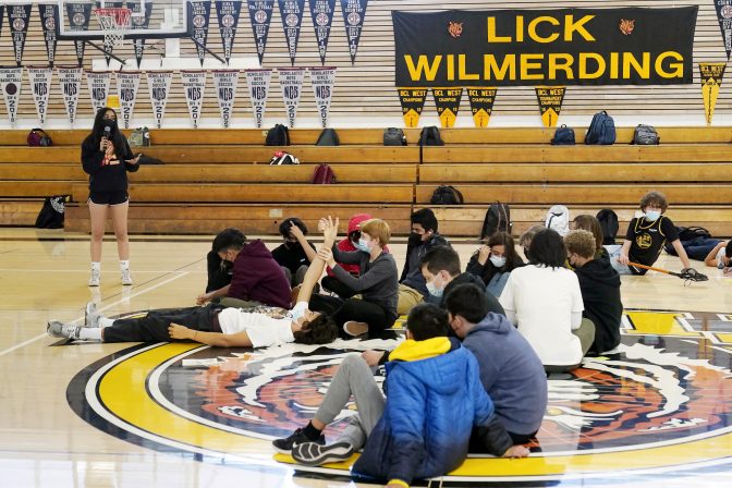 Lick-Wilmerding High School sophomore student leader Alia, left, speaks to students during a freshmen year Public Purpose Program workshop at the high school in San Francisco, March 9, 2022.