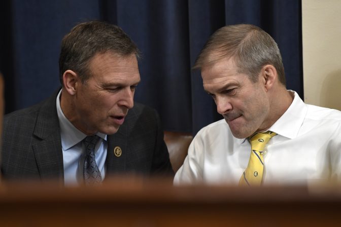 Rep. Scott Perry, R-Pa., talks with Rep. Jim Jordan, R-Ohio, during a break in testimony from former U.S. Ambassador to Ukraine Marie Yovanovitch at the House Intelligence Committee on Capitol Hill in Washington, Friday, Nov. 15, 2019.