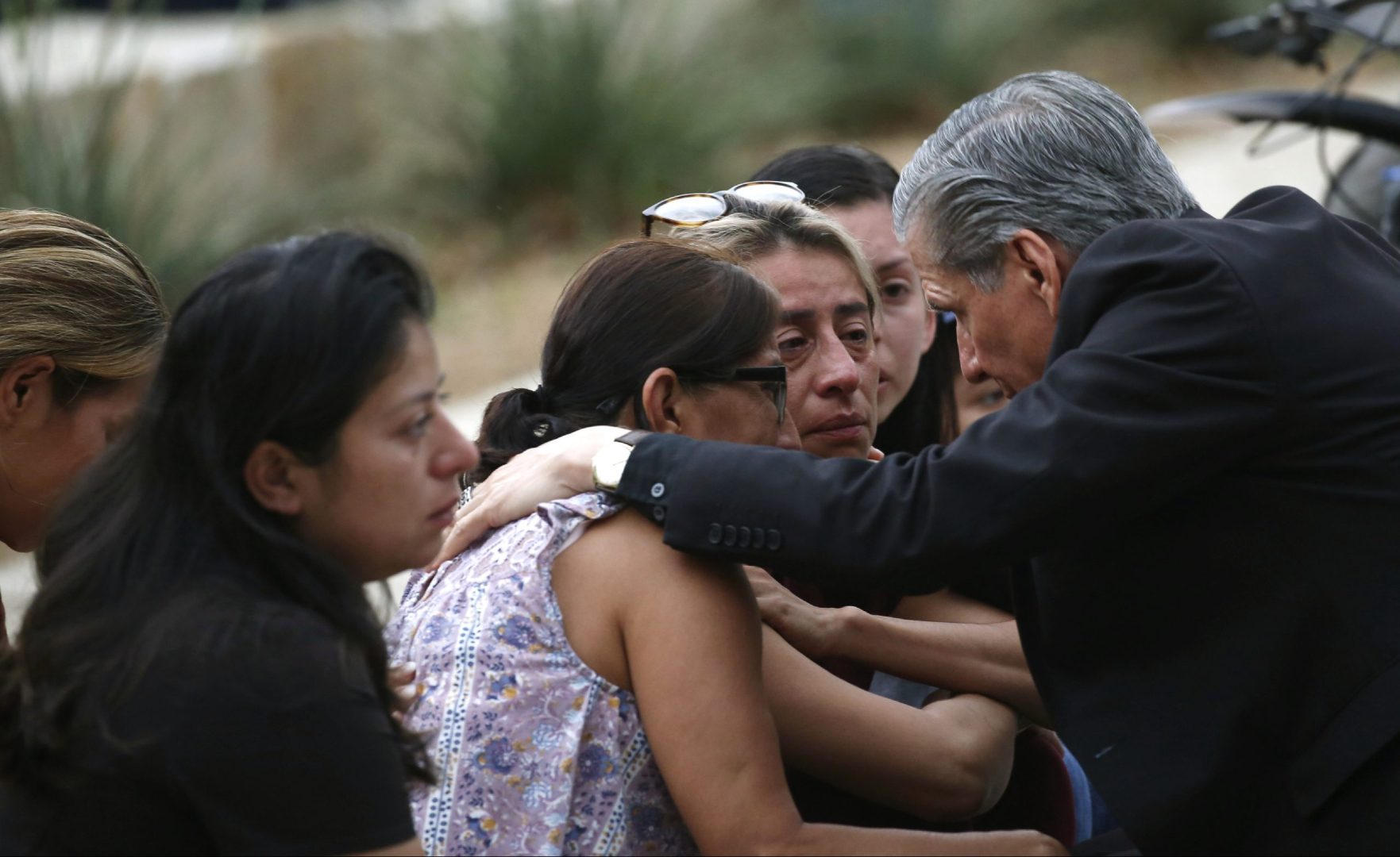 The archbishop of San Antonio, Gustavo Garcia-Siller, comforts families outside the Civic Center following a deadly school shooting at Robb Elementary School in Uvalde, Texas, Tuesday, May 24, 2022. 