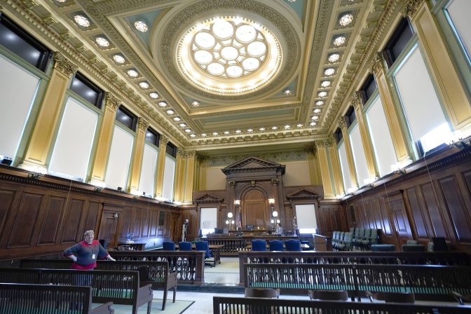 The new windows that were replaced with funding from shale gas fees line the walls of a courtroom at the county courthouse in Washington, Pa., March 28, 2022.