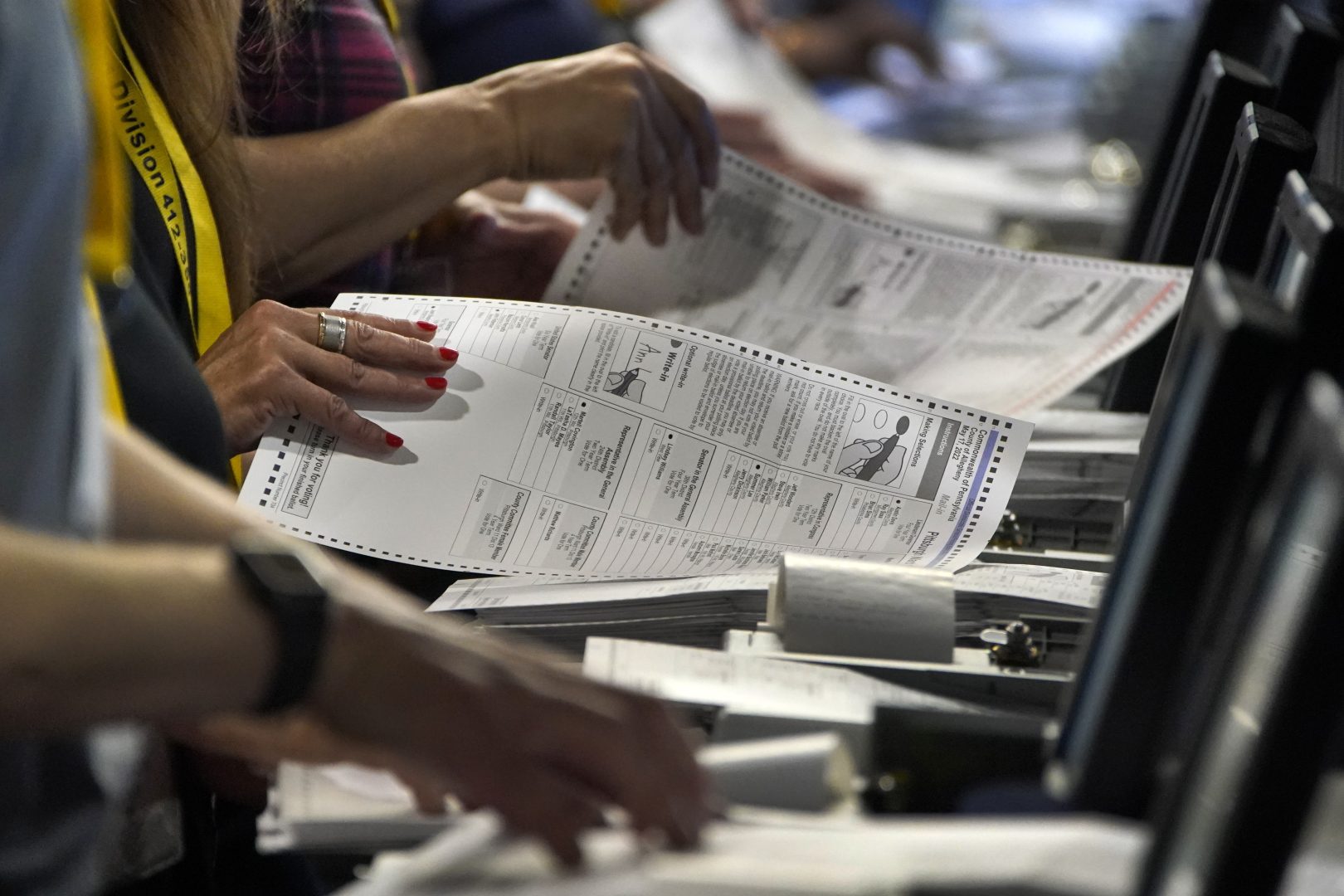  Election workers perform a recount of ballots from the recent Pennsylvania primary election at the Allegheny County Election Division warehouse on the Northside of Pittsburgh, June 1, 2022. 