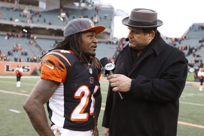 Television personality and former NFL player Tony Siragusa, right, interviews Cincinnati Bengals cornerback Adam Jones (24) after an NFL football game against the St. Louis Rams, Sunday, Nov. 29, 2015, in Cincinnati.