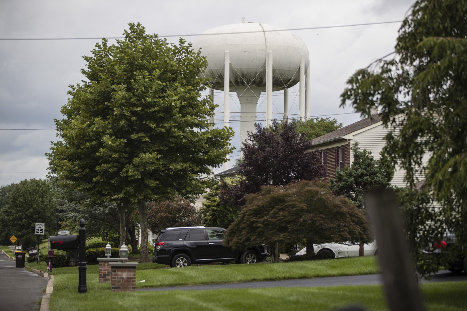 In this Aug. 1, 2018 photo, a water tower stands above a residential neighborhood in Horsham, Pa. In Horsham and surrounding towns in eastern Pennsylvania, and at other sites around the United States, the foams once used routinely in firefighting training at military bases contained per-and polyfluoroalkyl substances, or PFAS. EPA testing between 2013 and 2015 found significant amounts of PFAS in public water supplies in 33 U.S. states. 