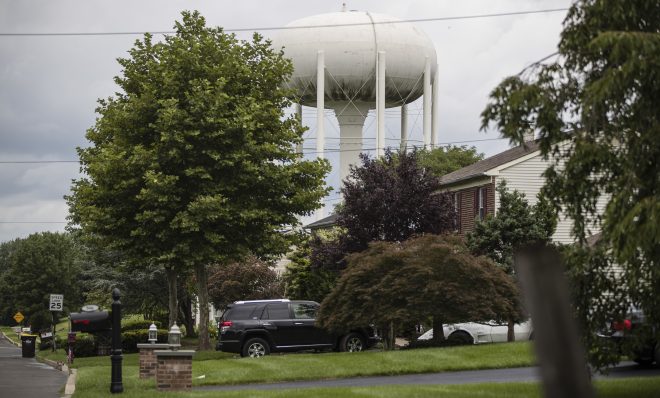 In this Aug. 1, 2018 photo, a water tower stands above a residential neighborhood in Horsham, Pa. In Horsham and surrounding towns in eastern Pennsylvania, and at other sites around the United States, the foams once used routinely in firefighting training at military bases contained per-and polyfluoroalkyl substances, or PFAS. EPA testing between 2013 and 2015 found significant amounts of PFAS in public water supplies in 33 U.S. states. 