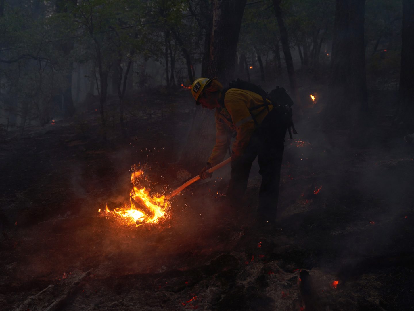 GENESEE, CA - AUGUST 21: A wildfire hot shot crew battles flames as the Dixie Fire pushes through the Genesee Valley on August 21, 2021 in Genesee, California. The Dixie Fire, Californias second largest wildfire in history, has grown to over 700,000 acres. (Photo by Allison Dinner/Getty Images)