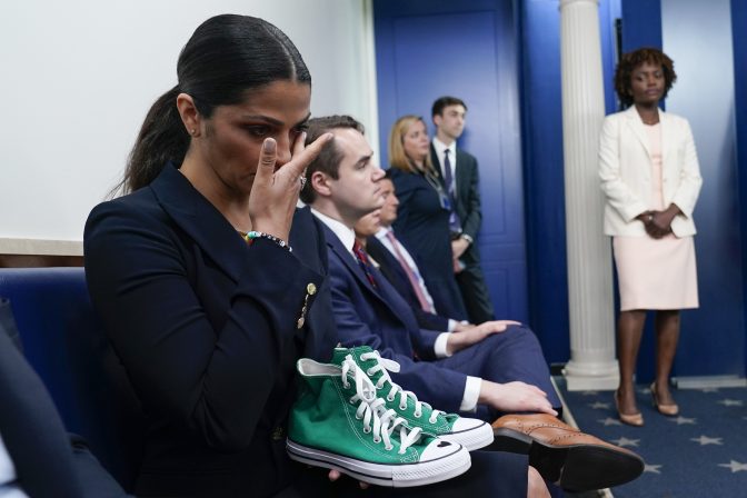 Camila Alves McConaughey holds the lime green Converse tennis shoes that were worn by Uvalde shooting victim Maite Yuleana Rodriguez, 10, as Matthew McConaughey, a native of Uvalde, Texas, joins White House press secretary Karine Jean-Pierre for the daily briefing at the White House in Washington, Tuesday, June 7, 2022.