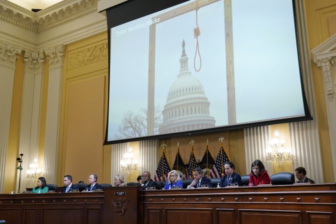 An image of a mock gallows on the grounds of the U.S. Capitol on Jan. 6th is shown as committee members from left to right, Rep. Stephanie Murphy, D-Fla., Rep. Pete Aguilar, D-Calif., Rep. Adam Schiff, D-Calif., Rep. Zoe Lofgren, D-Calif., Chairman Bennie Thompson, D-Miss., Vice Chair Liz Cheney, R-Wyo., Rep. Adam Kinzinger, R-Ill., Rep. Jamie Raskin, D-Md., and Rep. Elaine Luria, D-Va., look on, as the House select committee investigating the Jan. 6 attack on the U.S. Capitol holds its first public hearing to reveal the findings of a year-long investigation, at the Capitol in Washington, Thursday, June 9, 2022.