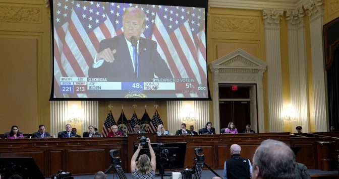 Chris Stirewalt, former Fox News political editor, bottom right, listens to a video as the House select committee investigating the Jan. 6 attack on the U.S. Capitol meets to reveal its findings of a year-long investigation, at the Capitol in Washington, Monday, June 13, 2022.