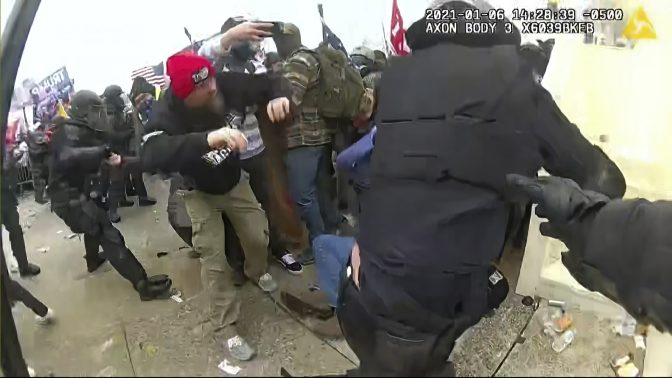 In this image from video released by the House Select Committee, the view from a police-worn body camera shows the scene on the West Front of the U.S. Capitol as rioters storm the Capitol, that the House select committee investigating the Jan. 6 attack on the U.S. Capitol showed at the hearing Monday, June 13, 2022, on Capitol Hill in Washington. 
