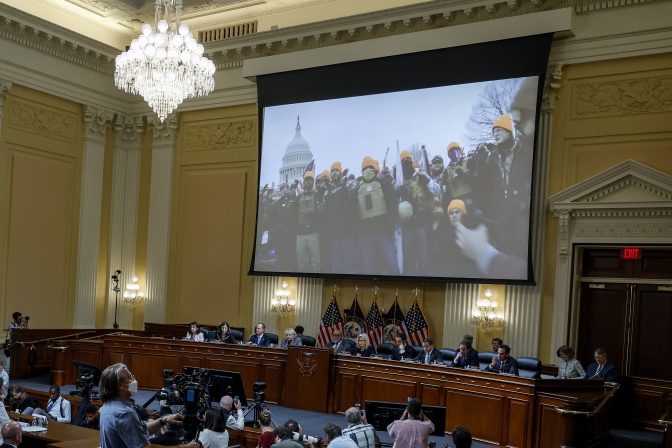 Video from January 6 is played as Cassidy Hutchinson, former aide to Trump White House chief of staff Mark Meadows, testifies as the House select committee investigating the Jan. 6 attack on the U.S. Capitol holds a hearing at the Capitol in Washington, Tuesday, June 28, 2022.