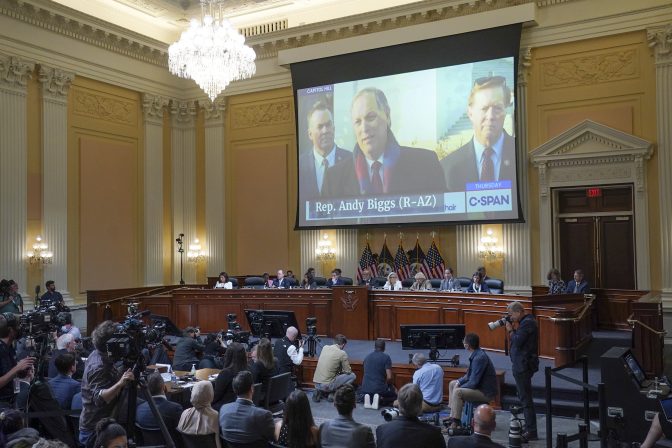 A video of Andy Biggs, R-Ariz., is shown on a screen, as the House select committee investigating the Jan. 6 attack on the U.S. Capitol continues to reveal its findings of a year-long investigation, Thursday, June 23, 2022, at the Capitol in Washington.