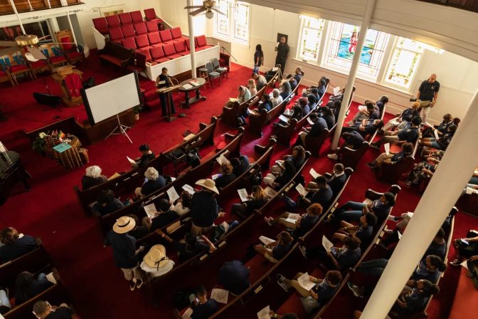 Students from the Franchell Boswell Educational Foundation listen to a Juneteenth presentation at Avenue L Baptist Church.