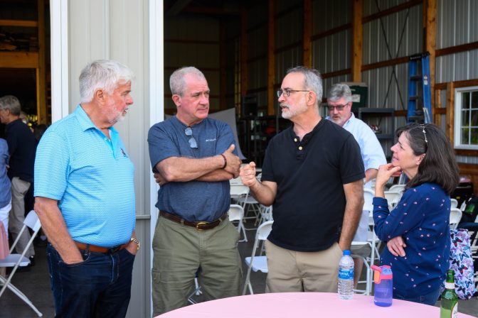 Gene Stocker, left, and Centre County Commissioner Steve Dershem, second from left, listen to residents during a neighborhood meeting in June to discuss PFAS, or "forever chemicals," water contamination.