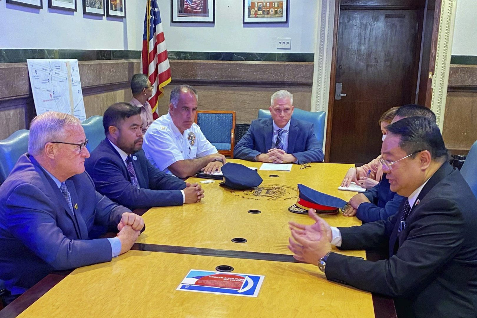 In this photo provided by Office of Philippine Consul-General Elmer Cato, Philippine Consul-General Elmer Cato, right, talks with Philadelphia Mayor Jim Kenney, left, at the Philadelphia City hall, PA., on Tuesday June 21, 2022. 